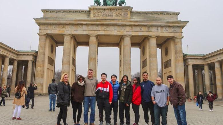 group of students and faculty in front of monument in Berlin